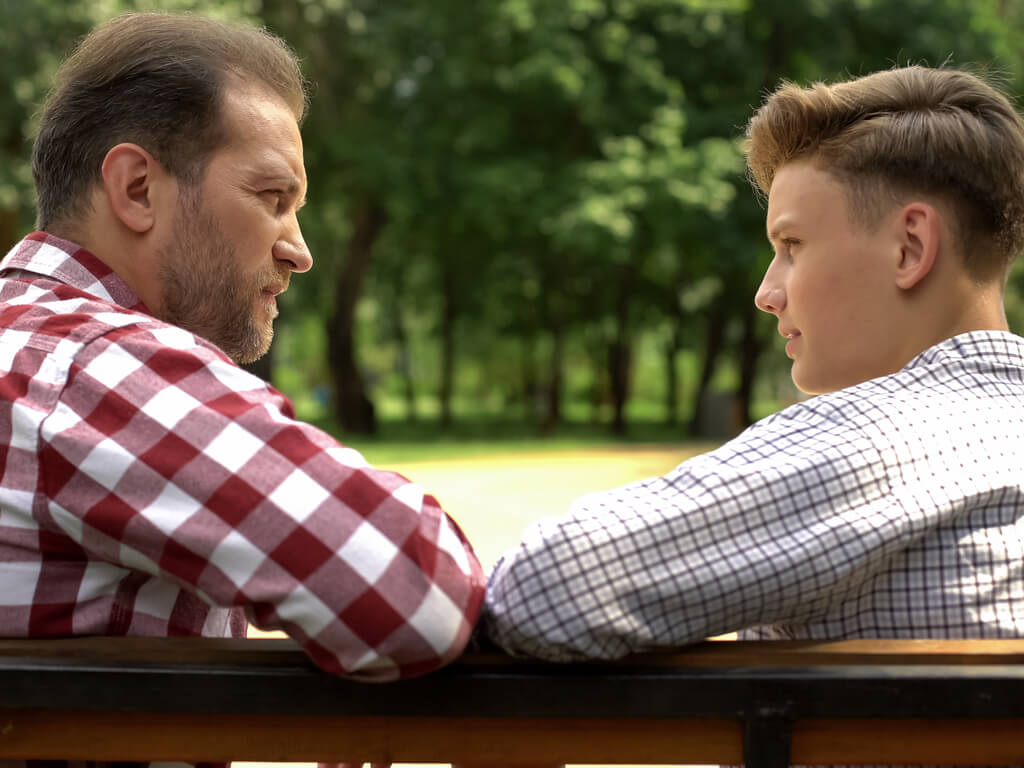 A father and son discussing plans for college so they can avoid student loans.